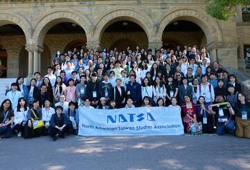 Participants at the NATSA 2025 conference post to the camera at the entrance to Encina Hall, Stanford University.