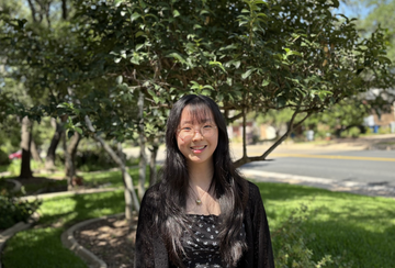 a person standing in front of trees