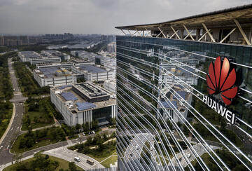 The Huawei logo is seen on the side of the main building at the company's production campus on April 25, 2019 in Dongguan, near Shenzhen, China.