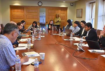 Stanford Next Asia Policy Lab team members and invited discussants during a roundtable discussion in a conference room.