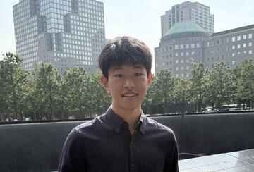 a person standing in front of buildings