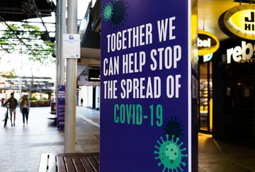 A sign that says "Together we can help stop the spread of COVID-19"