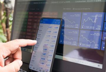 Forex trading using smartphones and laptops.