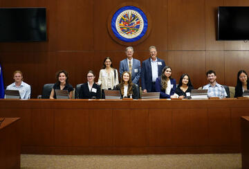 Members of the Fisher Family Honors Class of 2026 pose with faculty María Ignacia Curiel, Stephen Stedman, and Larry Diamond at the Organization of American States in Washington, D.C.