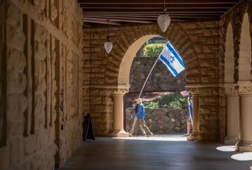 Pro-Israel demonstrators march across Stanford University in Palo Alto on May 12, 2024.