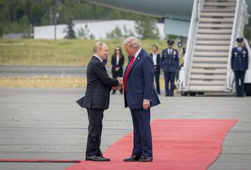 Trump and Putin shake hands