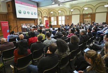 Large audience at Encina Hall listens to a discussion about global trends and geopolitics in 2026 by scholars at the Freeman Spogli Institute.