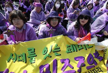 Women participate in a rally to celebrate International Women's Day in Seoul, South Korea.