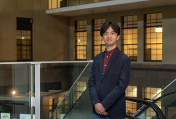 a person in a suit standing