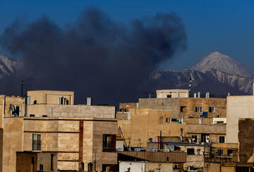 Smoke rises over buildings on March 3, 2026, in Tehran, Iran.