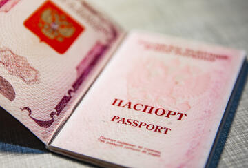 Russian passport on a gray stone background