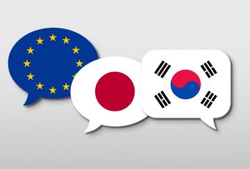 Illustration of three speech bubbles representing (from left to right) the flags of the EU, Japan, and South Korea.