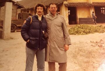 two men in jackets standing