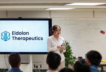 a person giving a presentation in a classroom