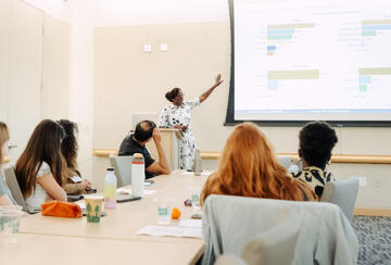 Maria Nagawa presents during the 2025 Global Development Postdoctoral Fellows Conference.