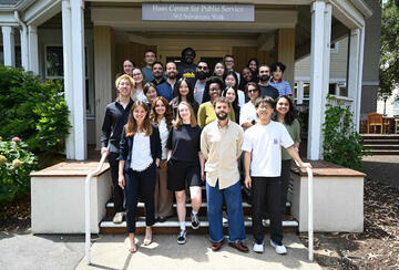 Students posing for a group photo on a set of steps