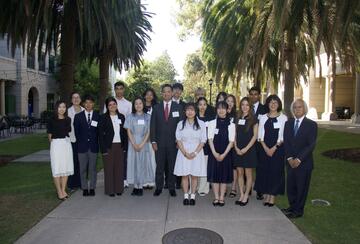 a group photo of students and instructors on campus