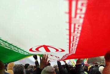 hands on Iranian flag