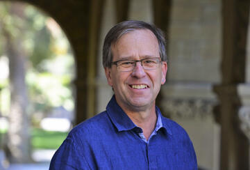 man with glasses smiling