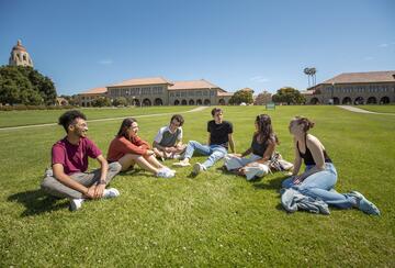 Six Stanford students sitting on grassy field