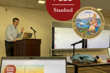 Mark Thurber teaching with Energy Market Game computer screen in foreground