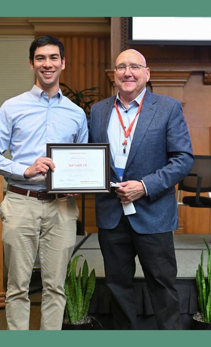 Nathan Lo accepts 2026 Rosenkranz Prize from Doug Owens