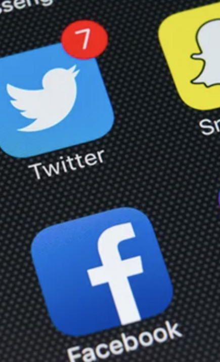 Image of social apps on a phone screen.