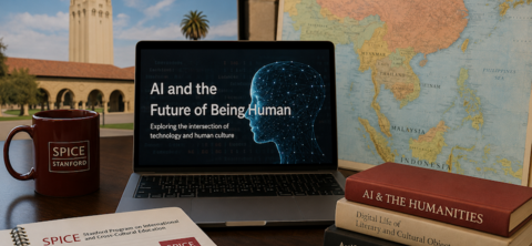 office desk with a laptop, notepad, and books about artificial intelligence