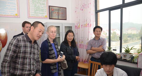 Karen Eggleston and peer researchers visiting with colleagues in China..