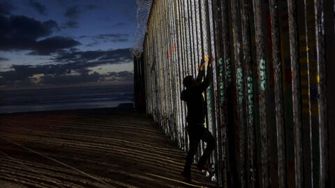 A man tries to climb U.S. southern border wall