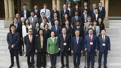 group of people standing on steps of Encina Hall at the 2024 Trans-Pacific Sustainability Dialogue