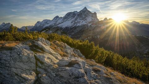 Snow-covered mountain during sunrise
