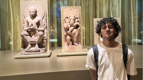Neil Rathi with Indian statues