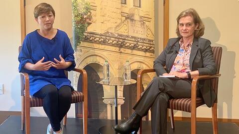 Ema Yamazaki and Katherine Monahan seated on stage during a fireside chat.