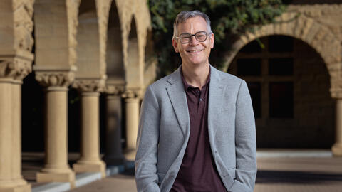 Colin H. Kahl standing in Stanford's main quad