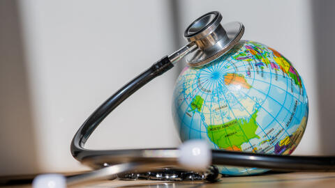 An illustration of a globe with stethoscope