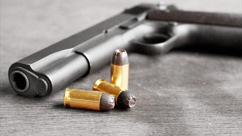 a handgun and bullets