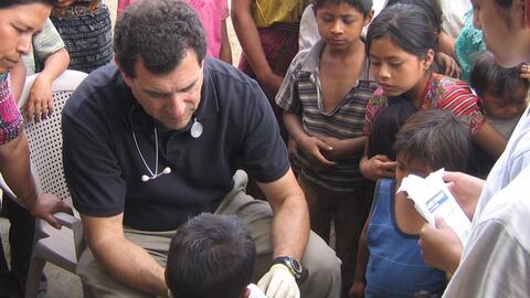 Paul Wise cares for an injured child
