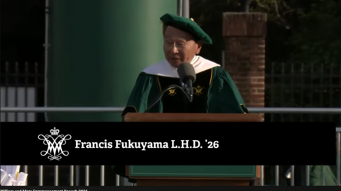Dr. Fukuyama in graduation regalia, at a podium, giving a speech to William and Mary graduates of the class of 2026