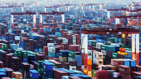 Feature figure showing vast field of shipping containers