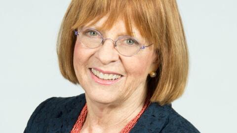 smiling woman with strawberry blond hair