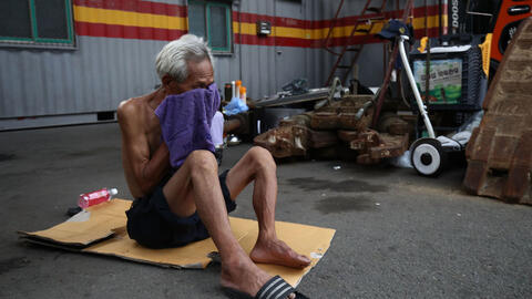 An elderly man in China during a heat wave