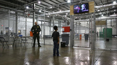 Boy watches a movie in U.S. detention center