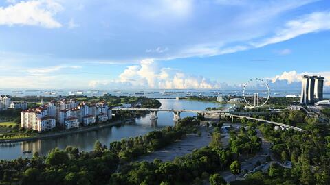 aerial view of Singapore city buildings near body of water during daytime