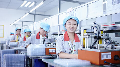 Workers at e-cigarettes battery factory, Guangdong, China.