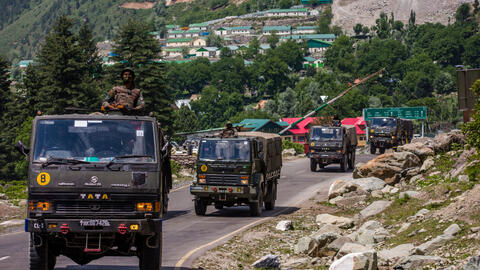 An Indian army convoy drives towards Leh, on a highway bordering China, on June 19, 2020 in Gagangir, India.