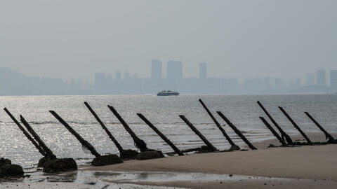 he Chinese city of Xamen is seen in the distance behind aged anti-landing barricades on a beach facing China on the Taiwanese island of Kinmen which, at points lies only a few miles from China, on April 19, 2018 in Kinmen, Taiwan. 