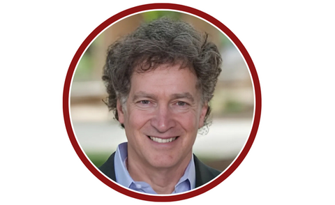 Circle headshot of Dr. Larry Goulder