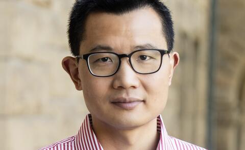 Headshot of Dr. Yiqing Xu.
