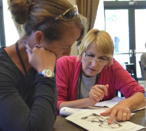 two teachers engaged in a classroom activity
